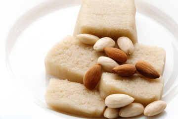 Almond and Marzipan on a white plate. Ingredients of Confectionery, Cakes for Easter, Christmas, New Year, Wedding. Dessert. Food. Sweets.