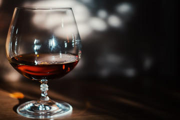 Close up view of cognac glass on the sunset time