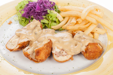 chicken breast stuffed with mushroom sauce and french fries