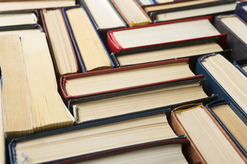 Stack of books background. many books piles.