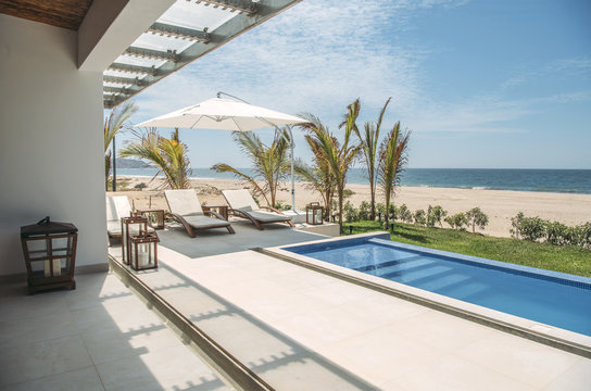 Pool and loungers at villa