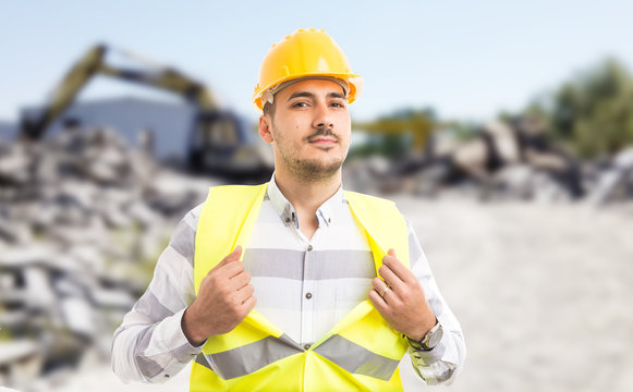 Professional worker acting like a superhero showing chest.