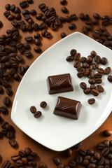 coffee chocolates with coffee beans next to it