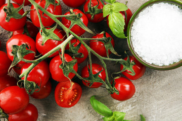 Ripe tasty red tomatoes with salt and basil. Village market organic tomatoes. Fresh tomato
