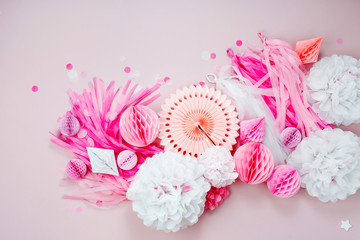 Pink and white Paper Decorations for Baby  party. Flat lay, top view