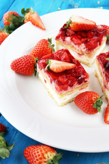 strawberry cake with fresh strawberries and whipped cream.