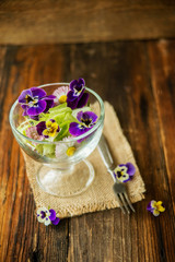 Close up salad leaves garden herbs and edible flowers. Healthy nutrition. Food background