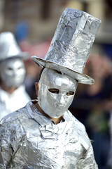 unrecognizable man wrapped with aluminium foil,
