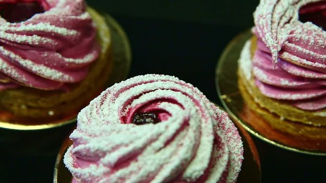 closeup row of pink zephyr on black background