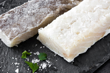 Salted dried cod on black stone. Typical Easter food