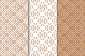 Brown floral backgrounds. Set of seamless patterns
