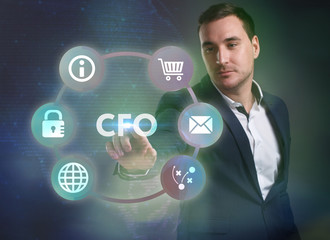 Business, Technology, Internet and network concept. Young businessman working on a virtual screen of the future and sees the inscription: CFO