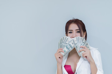 Portrait of asian sexy woman with a lot of money on white background,thailand people,The rich business woman concept