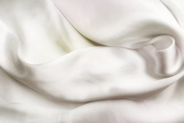 Elegant white satin silk with waves, abstract background