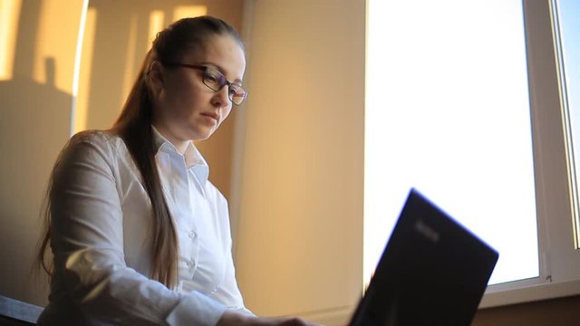 business woman works in office office computer. Compiles a financial report and scolds his employees by phone. Emotions, shouts, swears.
