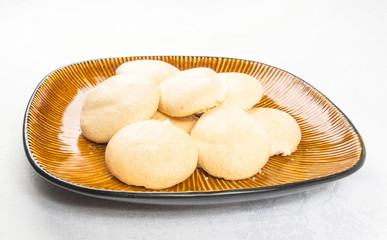 brown plate with meringues