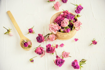 Dried rose petals: for tea, alternative medicine, pot-pourri. Copy space.