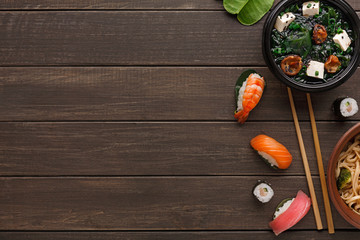 Miso soup with tofu cheese on wooden background