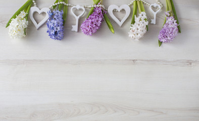 a festive background with hyacinths, hearts and pearls. March 8, mother's day, wedding, birthday.