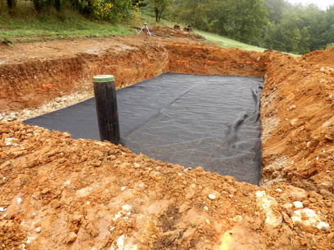 Membrane laid to separate the sand from the gravel in the construction of a sand and gravel filter bed