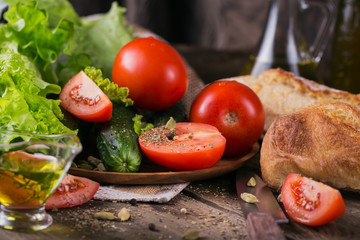 tomato, cucumber, lettuce, baguette, olive oil and spices