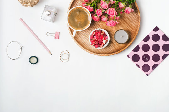 Feminine accessories, coffee and roses on the white background