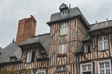 Close up of historic half-timbered houses with chimneys in old town of Rennes (Brittany, France)