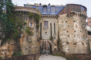 Portes Mordelaises, castle entrance gate with two towers,  drawbridge and medieval walls once served to defend city of Rennes (Brittany, France)