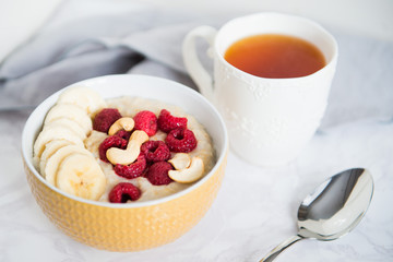 healthy oatmeal Breakfast with banana and raspberry