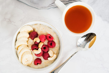 healthy oatmeal Breakfast with banana and raspberry