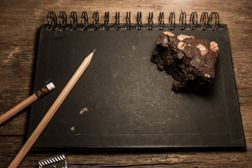 pencil and eraser on blackboard