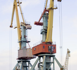 old port crane on background sky