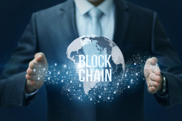 Businessman showing the Block chain in hands.