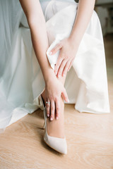 Bride in white wedding dress . Hands of the bride.