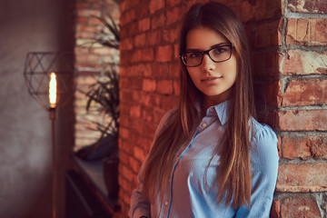 Fototapeta premium Portrait of a charming brunette in a studio.