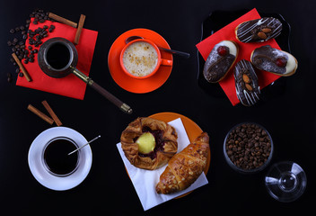 Panorama with a Cup of coffee, cakes and croissants