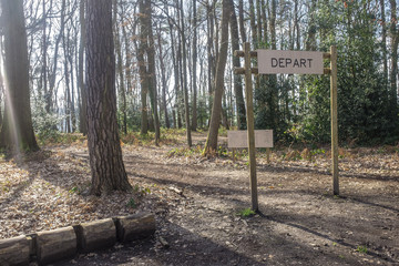 Fitness training in forest. Sign planted in a forest that indicates 