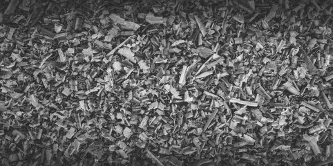 Wooden shavings, background with vignetting, black and white toning