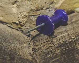 Close up of Drawing Pin on Wooden Uneven Surface, Macro Split Toning Shallow Depth of Field