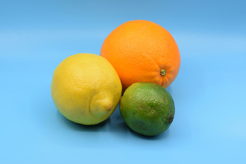 Citrus fruits on seamless blue background
