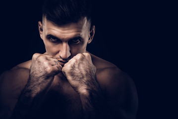 Portrait of MMA fighter in crouch stance