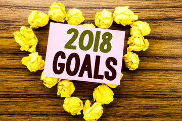 Fototapeta premium Word, writing 2018 Goals. Business concept for New Yer resolutions written on sticky note paper on the wooden background.