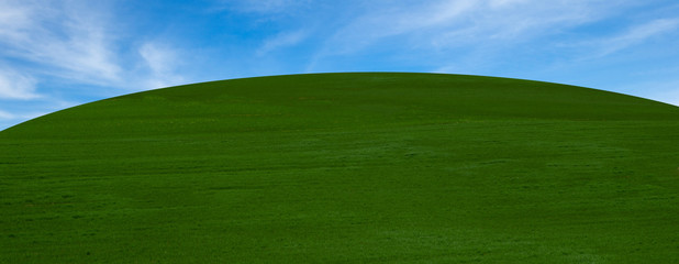 A panoramic view of a green and blue landscape