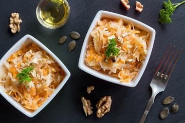 Fermented cabbage and carrots in two bowls