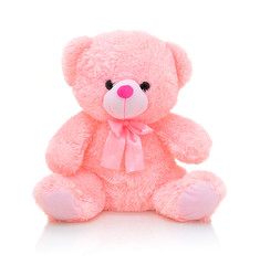 Cute pink bear doll with bow isolated on white background with shadow reflection. Playful bright...