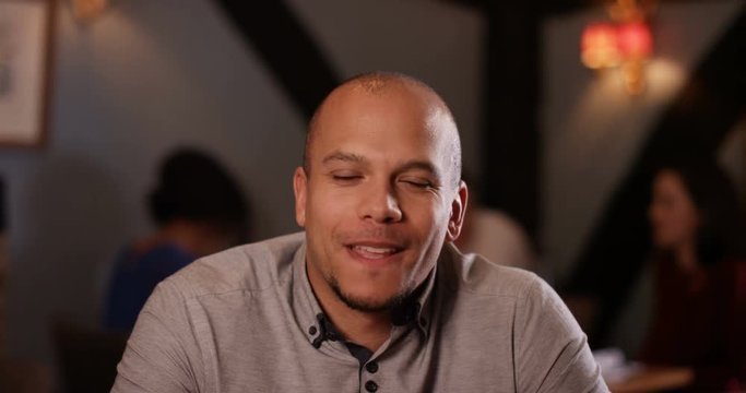 4K Young man making small talk on a date in restaurant. As seen from his date's point of view