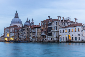 Naklejka premium View of the channels and old palaces in Venice at sunset - 1