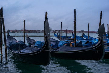Fototapeta na wymiar Gondolas in the morning in Venice before the tourist arrival - 1