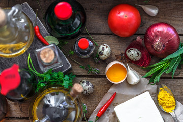 Various ingredients for cooking: oils, sauces, spices and vegetables