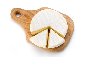 Piece of camembert cheese isolated on white background. From top view.
